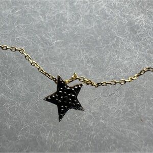 Black diamond star pendant on 14k gold chain